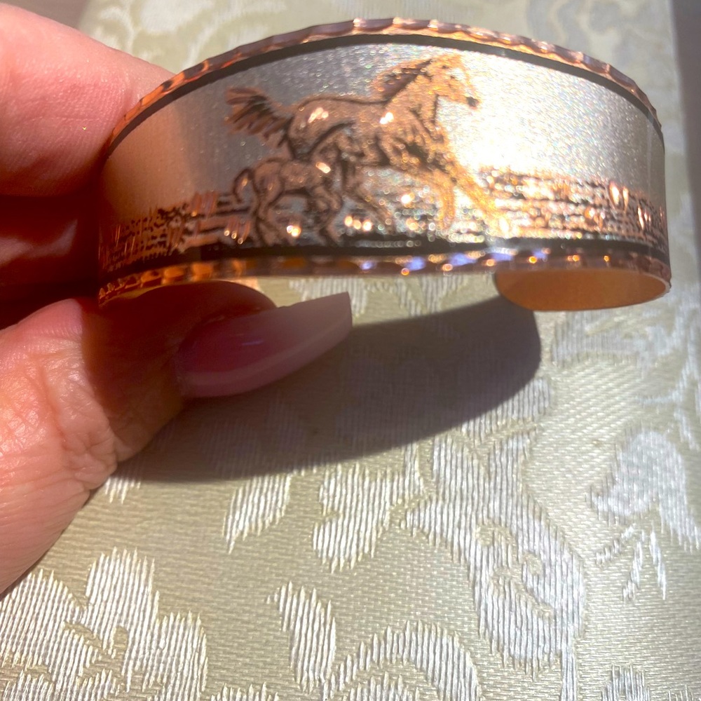 Copper horse motif slip on bracelet
